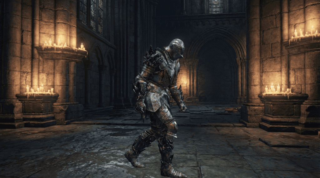 Dark Souls Archthrones gameplay showing the new Enfeeblement curse status effect with purple crystals slowing down the player character in the Cathedral.